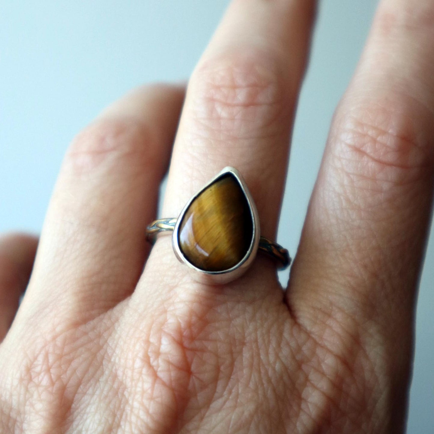 ANILLO TRENZADO OJO DE TIGRE